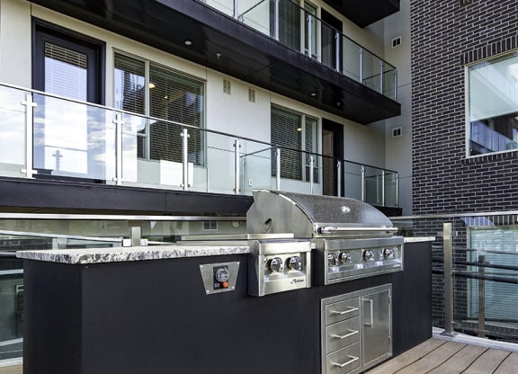 a barbecue grill in the middle of a patio