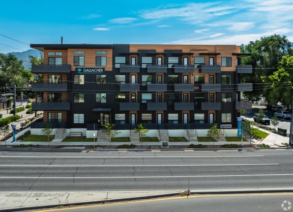 a large apartment building on the side of a street at Lotus Gallacher luxury apartments for rent in Salt Lake City, UT