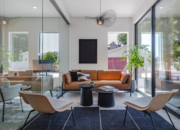 a living room with a couch and chairs and a table at Lotus Gallacher luxury apartments for rent in Salt Lake City, UT