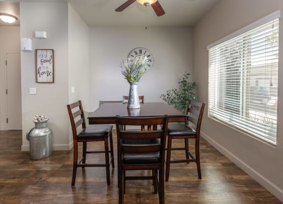a dining room with a large clock on the wall