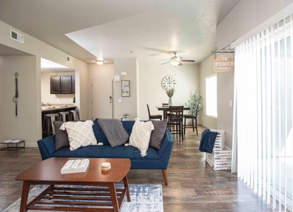 a living room with a blue couch and a coffee table