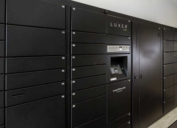 a row of lockers with an atm in the door