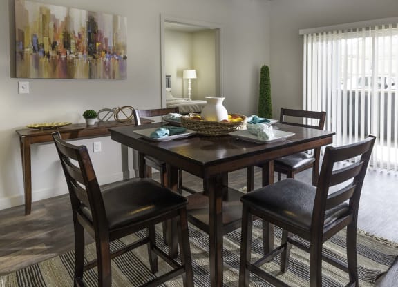 a dining room with a table and chairs