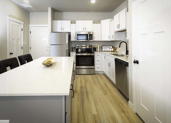 kitchen and island seating at VALO at South Haven Farms townhomes in Payson, UT