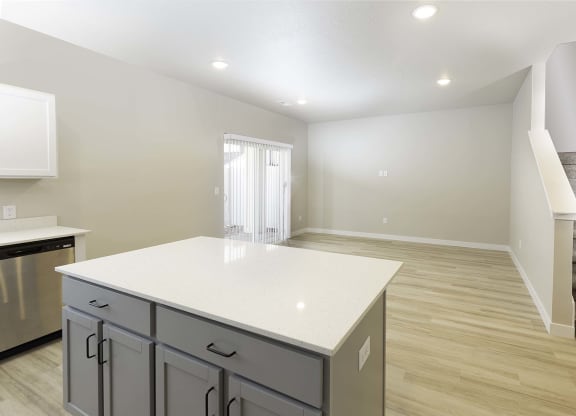 kitchen island and dining area at VALO at South Haven Farms townhomes in Payson, UT