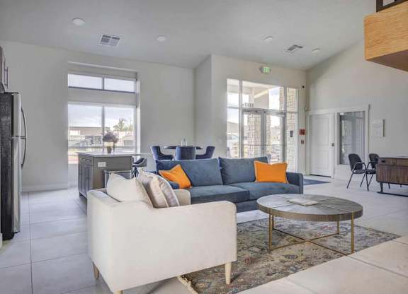 A living room with a white couch and a coffee table.