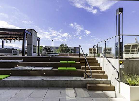 A set of stairs with green steps leading up to a building.