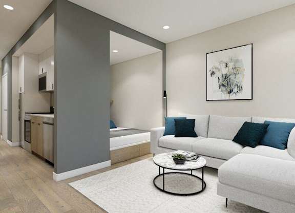A modern living room with a grey and white color scheme.