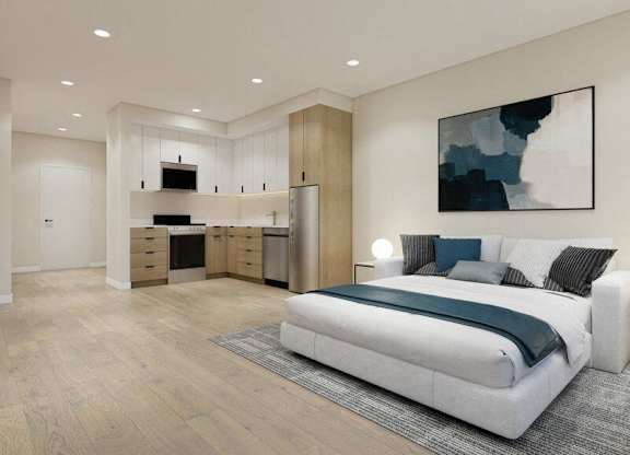 A modern bedroom with a large bed and a painting on the wall.