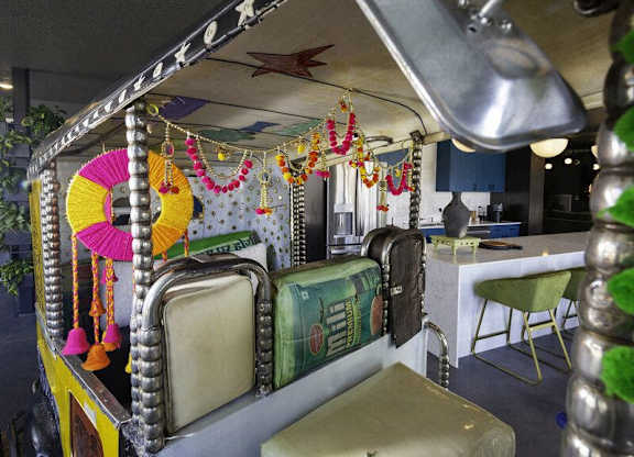 A decorated canopy with a sign that reads "KOLKATA" is in the foreground.
