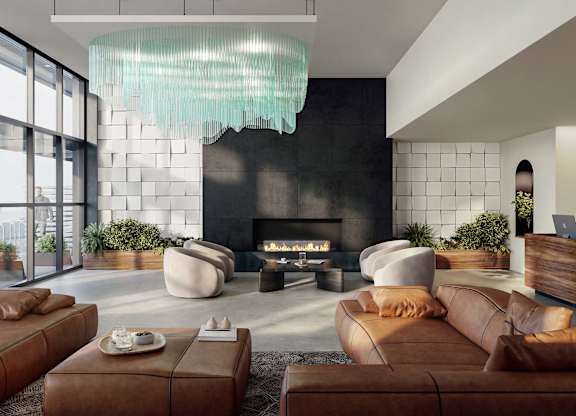 A modern living room with a fireplace and a large window.