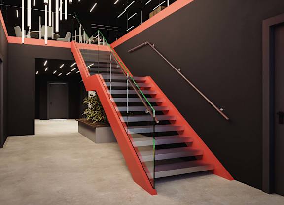 A red staircase with a planter box at the bottom.