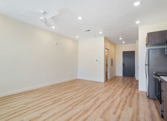 an empty kitchen and living area