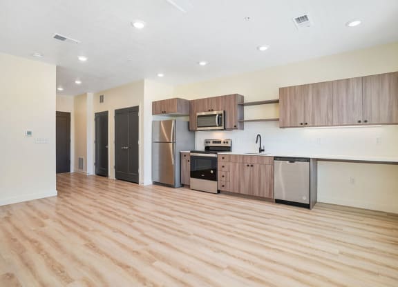 a large empty kitchen and living area