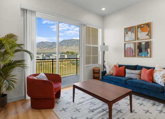 a furnished living room with sliding glass doors