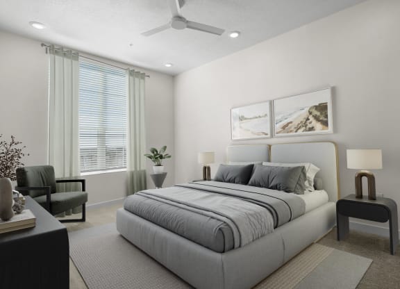 a furnished bedroom with grey bedding