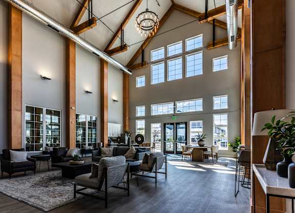 A large, open-concept living space with high ceilings and natural light.