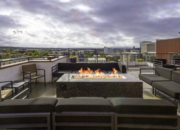 exterior fire place with couches at The Lotus Apartments in Downtown Salt Lake City, Utah