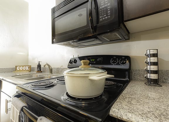 a kitchen stove and microwave from The Lotus Apartments in Downtown Salt Lake City, Utah