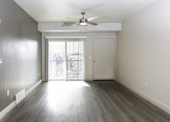interior photo of a living room with a large window from The Lotus Apartments in Downtown Salt Lake City, Utah