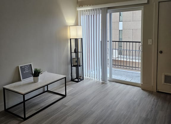 interior photo of a living area with a sliding glass door from The Lotus Apartments in Downtown Salt Lake City, Utah