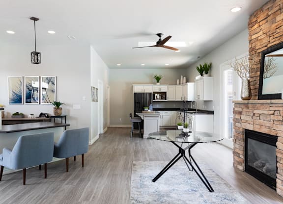 A modern kitchen with a dining table and chairs.