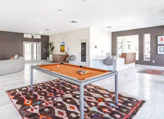 a pool table in the middle of a living room