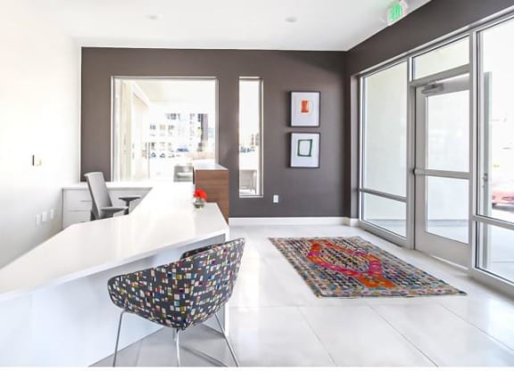 a large room with a lobby and a glass door