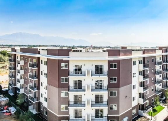 Aerial view of Lehi Tech Apartments in Lehi, UT, showcasing the community layout, modern buildings, and surrounding landscape.