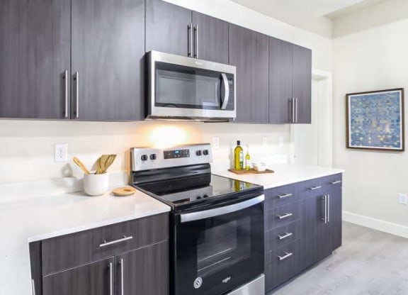 a kitchen with a stove and a microwave