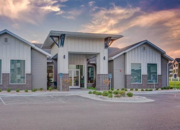 an empty parking lot in front of a building  at Affinity 56 Apartments in West Jordan, Utah