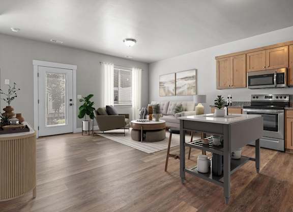 A modern kitchen with wooden floors and a large island.