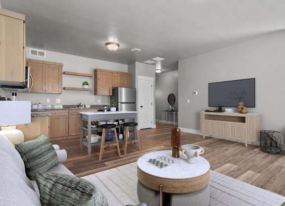 A modern living room with a grey couch and a wooden coffee table.