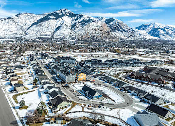A small town with a mountain in the background.