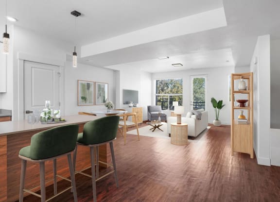 a living room and dining room with a table and chairs