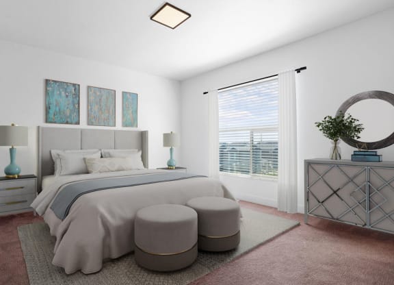 a bedroom with a large bed and a window