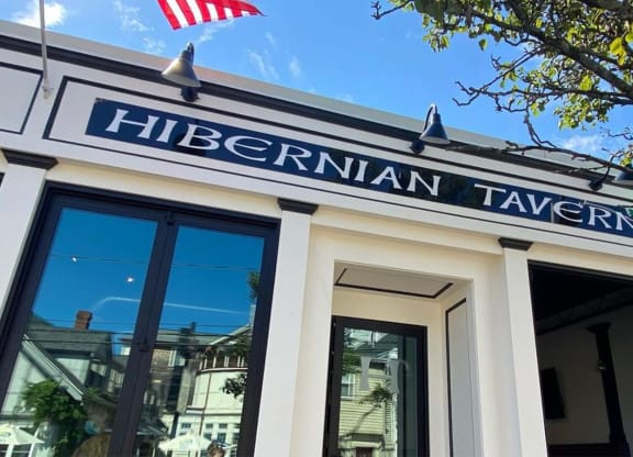 a restaurant with a sign on the front of it