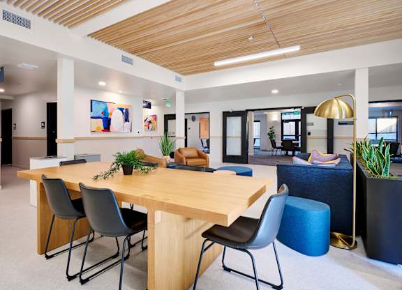 A conference room with a long table and chairs.