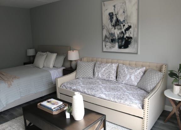 a living room with a couch and a bed at Schaefer Ridge Apartments, Branson ,Missouri, 65616q