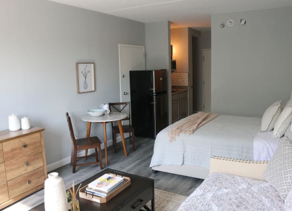 a bedroom with a bed and a couch and a table at Schaefer Ridge Apartments, Branson , MO