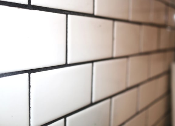 a close up of a white tiled wall with white subway tiles at Schaefer Ridge Apartments, Branson , MO 65616
