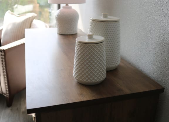 a wooden table with jars and vases on it at Schaefer Ridge Apartments, Missouri