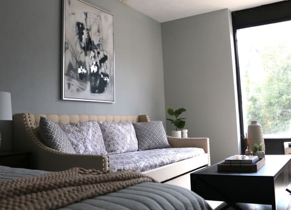 a living room with a couch and a bed at Schaefer Ridge Apartments, Branson , Missouri