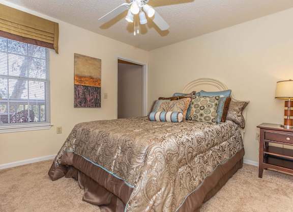 a bedroom with a bed and a ceiling fan at Arbors at Windsor Lake, Columbia South Carolina