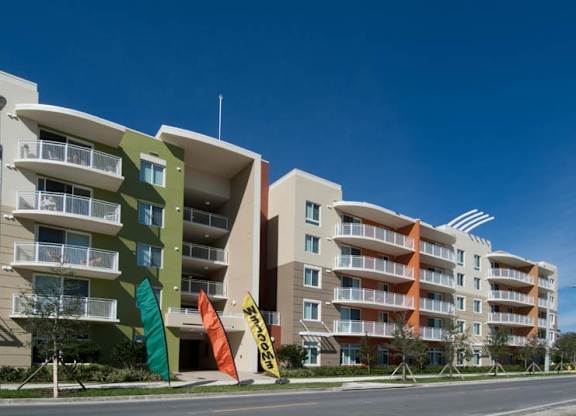 an apartment building on the side of a street