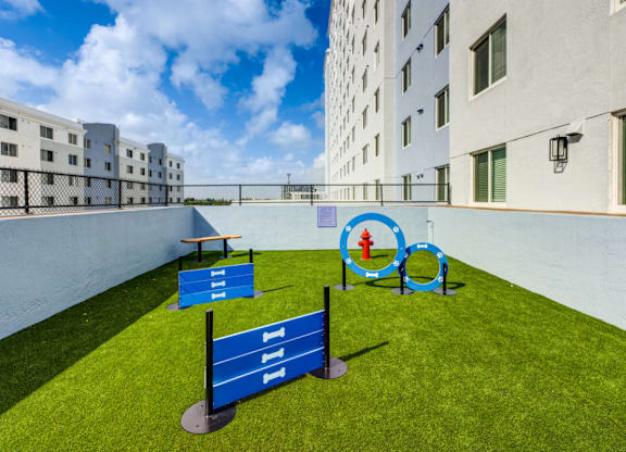 A blue sign with the number 111 is in the foreground of a grassy area.