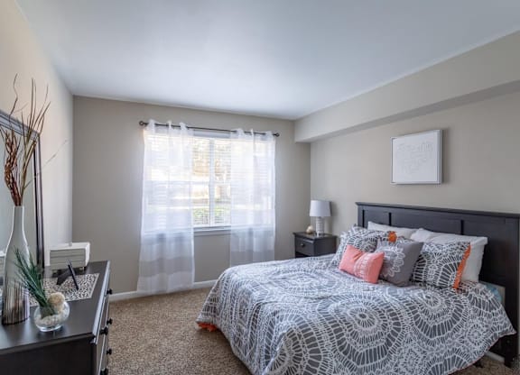 a bedroom with a large bed and a large window at Bradley Square, South Carolina, 29406