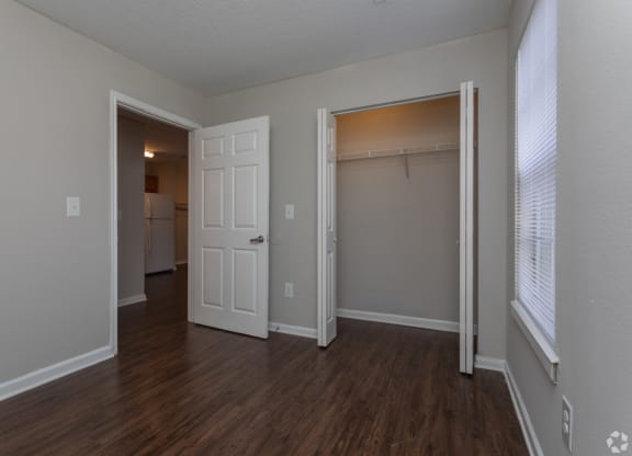 an empty living room with a closet and a window at Canaan Pointe, South Carolina, 29607