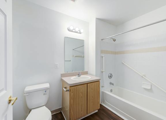 a bathroom with a toilet sink and shower at Carolina Springs Apartments, Carrboro 