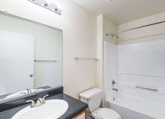 a bathroom with a sink and a toilet and a shower at Crescent Pointe Townhomes, Stafford, VA